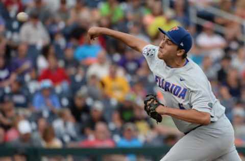 Jun 24, 2017; Omaha, NE, USA; Florida Gators pitcher Alex Faedo (21) pitches in the first inning against the TCU Horned Frogs at TD Ameritrade Park Omaha. Mandatory Credit: Steven Branscombe-USA TODAY Sports