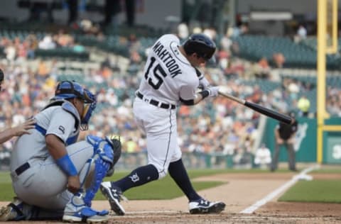 Jun 27, 2017; Detroit, MI, USA; Detroit Tigers center fielder Mikie Mahtook (15) hits a single in the first inning against the Kansas City Royals at Comerica Park. Mandatory Credit: Rick Osentoski-USA TODAY Sports