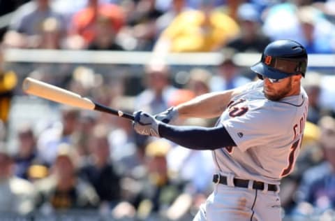 Apr 14, 2016; Pittsburgh, PA, USA; Detroit Tigers center fielder Tyler Collins (18) hits an RBI double against the Pittsburgh Pirates during the seventh inning in an inter-league game at PNC Park. Mandatory Credit: Charles LeClaire-USA TODAY Sports