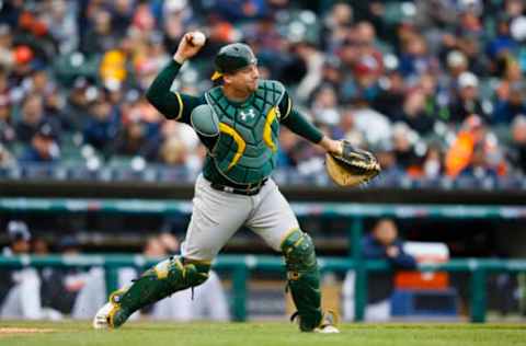 Apr 28, 2016; Detroit, MI, USA; Oakland Athletics catcher Stephen Vogt (21) makes a throw to second as Detroit Tigers right fielder J.D. Martinez (not pictured) advances on a wild pitch during the sixth inning at Comerica Park. Mandatory Credit: Rick Osentoski-USA TODAY Sports