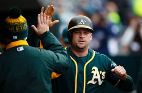 Apr 28, 2016; Detroit, MI, USA; Oakland Athletics catcher Stephen Vogt (21) receives congratulations from teammates after he hits a home run in the fourth inning against the Detroit Tigers at Comerica Park. Mandatory Credit: Rick Osentoski-USA TODAY Sports