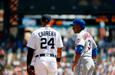 Aug 7, 2016; Detroit, MI, USA; Detroit Tigers first baseman Miguel Cabrera (24) and New York Mets right fielder Curtis Granderson (3) during the game at Comerica Park. Mandatory Credit: Rick Osentoski-USA TODAY Sports