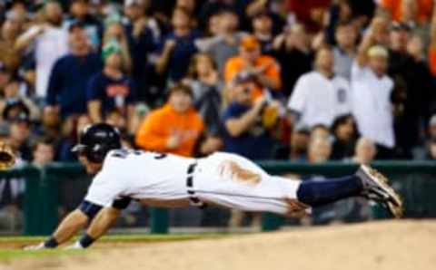 Sep 14, 2016; Detroit, MI, USA; Detroit Tigers second baseman Ian Kinsler (3) dives in safe at third after he hits an RBI triple in the fourth inning against the Minnesota Twins at Comerica Park. Mandatory Credit: Rick Osentoski-USA TODAY Sports