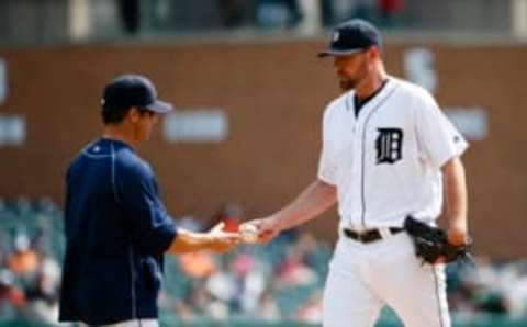 Sep 15, 2016; Detroit, MI, USA; Detroit Tigers manager Brad Ausmus (7) takes the ball to relieve starting pitcher Mike Pelfrey (37) in the second inning against the Minnesota Twins at Comerica Park. Mandatory Credit: Rick Osentoski-USA TODAY Sports