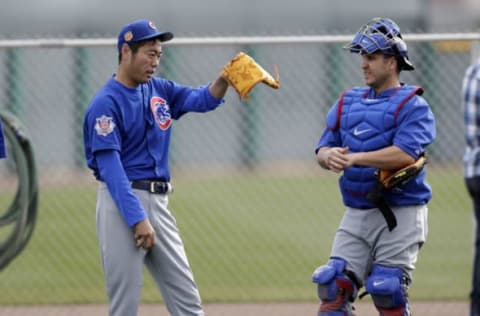 Feb 17, 2017; Mesa, AZ, USA; Chicago Cubs relief pitcher Koji Uehara (19) talks with Miguel Montero (47) after throwing in the bullpen during spring training camp at Sloan Park. Mandatory Credit: Rick Scuteri-USA TODAY Sports