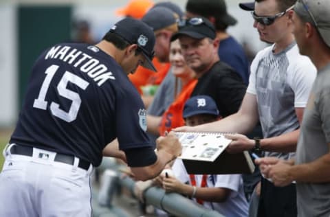 Feb 24, 2017; Lakeland, FL, USA; Detroit Tigers center fielder Mikie Mahtook (15) signs autographs before during a spring training baseball game at Joker Marchant Stadium. Mandatory Credit: Reinhold Matay-USA TODAY Sports