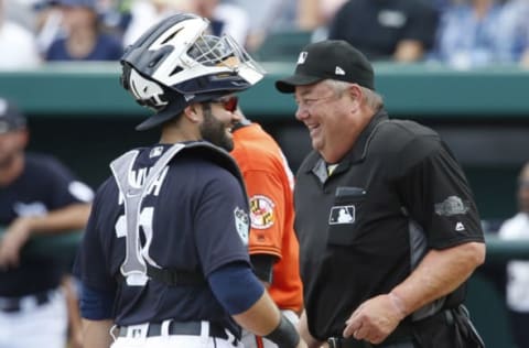 Feb 24, 2017; Lakeland, FL, USA; umpire Joe West (22) and Detroit Tigers catcher Alex Avila (31) share a laugh at home plate during the third inning of a spring training baseball game at Joker Marchant Stadium. Mandatory Credit: Reinhold Matay-USA TODAY Sports