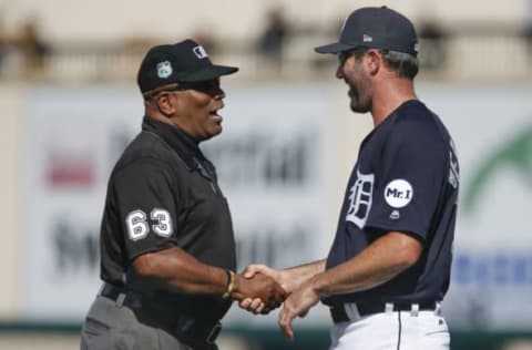 Feb 24, 2017; Lakeland, FL, USA; umpire Laz Diaz (63) says good bye to Detroit Tigers starting pitcher Justin Verlander (35) who left the game following the fourth inning of a spring training baseball game against the Baltimore Orioles at Joker Marchant Stadium. Mandatory Credit: Reinhold Matay-USA TODAY Sports