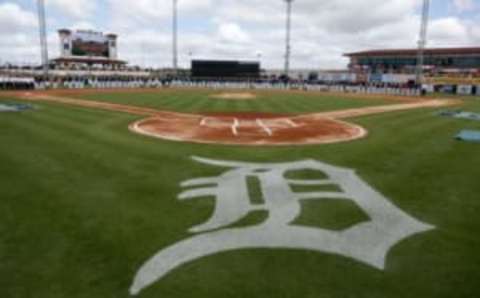 Feb 24, 2017; Lakeland, FL, USA; Members past and present of the Detroit Tigers stand on the baseline between first and third base to pay tribute to the life of Tigers owner Mike Ilitch before the start of a spring training baseball game against the Baltimore Orioles at Joker Marchant Stadium. Ilitch passed away earlier this week. Mandatory Credit: Reinhold Matay-USA TODAY Sports