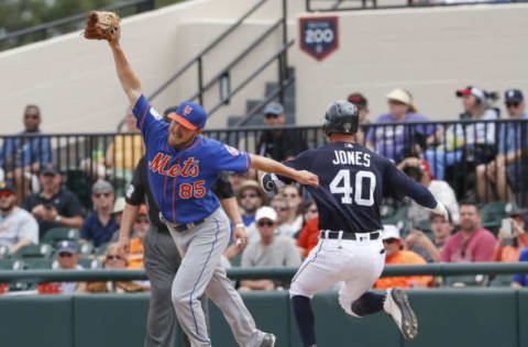 Mar 12, 2017; Lakeland, FL, USA; New York Mets starting pitcher Adam Wilk (85) stretches to get out Detroit Tigers center fielder JaCoby Jones (40) at first base during the third inning of an MLB spring training baseball game at Joker Marchant Stadium. Mandatory Credit: Reinhold Matay-USA TODAY Sports