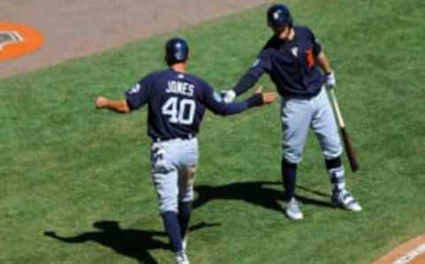 Mar 16, 2017; Lake Buena Vista, FL, USA; Detroit Tigers center fielder JaCoby Jones (40) reacts with shortstop Brendan Ryan (26) after scoring a run against the Atlanta Braves in the sixth inning at Champion Stadium. Mandatory Credit: Aaron Doster-USA TODAY Sports