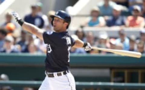 Mar 20, 2017; Lakeland, FL, USA; Detroit Tigers third baseman Andrew Romine (17) hits a ground rule double to right during the second inning of an MLB spring training baseball game against the New York Mets at Joker Marchant Stadium. Mandatory Credit: Reinhold Matay-USA TODAY Sports