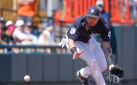 Mar 20, 2017; Lakeland, FL, USA; Detroit Tigers third baseman Nick Castellanos (9) fields a ground ball during the fifth inning of an MLB spring training baseball game against the New York Mets at Joker Marchant Stadium. Mandatory Credit: Reinhold Matay-USA TODAY Sports