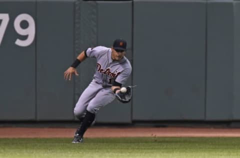 Jun 9, 2017; Boston, MA, USA; Detroit Tigers center fielder Mikie Mahtook (15) fields a ball during the sixth inning against the Boston Red Sox at Fenway Park. Mandatory Credit: Bob DeChiara-USA TODAY Sports