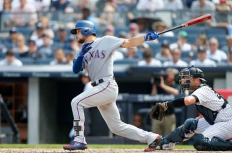 NEW YORK, NY – AUGUST 12: Isiah Kiner-Falefa #9 of the Texas Rangers follows through on a seventh inning run scoring ground out against the New York Yankees at Yankee Stadium on August 12, 2018 in the Bronx borough of New York City. (Photo by Jim McIsaac/Getty Images)