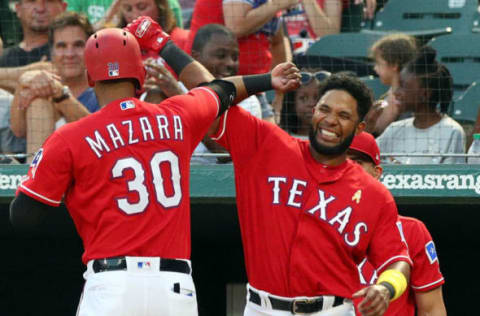 ARLINGTON, TX – SEPTEMBER 01: Nomar Mazara #30 of the Texas Rangers bumps elbows with Elvis Andrus #1 after a solo home run in the second inning against the Minnesota Twins at Globe Life Park in Arlington on September 1, 2018 in Arlington, Texas. (Photo by Richard Rodriguez/Getty Images)