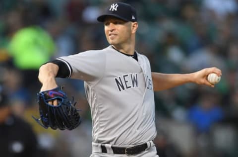 OAKLAND, CA – SEPTEMBER 04: J.A. Happ #34 of the New York Yankees pitches against the Oakland Athletics in the bottom of the first inning at Oakland Alameda Coliseum on September 4, 2018 in Oakland, California. (Photo by Thearon W. Henderson/Getty Images)