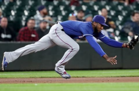 SEATTLE, WA – SEPTEMBER 27: Jurickson Profar #19 of the Texas Rangers reaches for a line out by Mitch Haniger #17 of the Seattle Mariners in the first inning during their game at Safeco Field on September 27, 2018 in Seattle, Washington. (Photo by Abbie Parr/Getty Images)