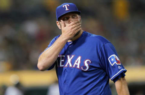 OAKLAND, CA – APRIL 23: Pitcher Lance Lynn #35 of the Texas Rangers walks back to the dugout after he was taken out of the game against the Oakland Athletics in the bottom of the fourth inning at Oakland-Alameda County Coliseum on April 23, 2019 in Oakland, California. (Photo by Thearon W. Henderson/Getty Images)