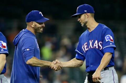 DETROIT, MI – JUNE 26: Manager Chris Woodward #8 of the Texas Rangers congratulates starting pitcher Mike Minor #23 of the Texas Rangers after pitching a complete, game 4-1 win, over the Detroit Tigers at Comerica Park on June 26, 2019 in Detroit, Michigan. (Photo by Duane Burleson/Getty Images)