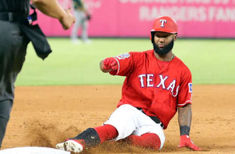 ARLINGTON, TEXAS – JUNE 08: Danny Santana #38 of the Texas Rangers slides into third on an RBI triple that scored Rougned Odor in the sixth inning against the Texas Rangers during game two of a doubleheader at Globe Life Park in Arlington on June 08, 2019 in Arlington, Texas. (Photo by Richard Rodriguez/Getty Images)