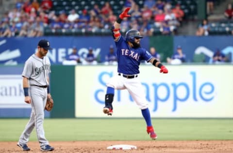 ARLINGTON, TEXAS – JULY 31: Rougned Odor #12 of the Texas Rangers reacts after hitting a double in front of Austin Nola #23 of the Seattle Mariners in the first inning at Globe Life Park in Arlington on July 31, 2019 in Arlington, Texas. (Photo by Ronald Martinez/Getty Images)