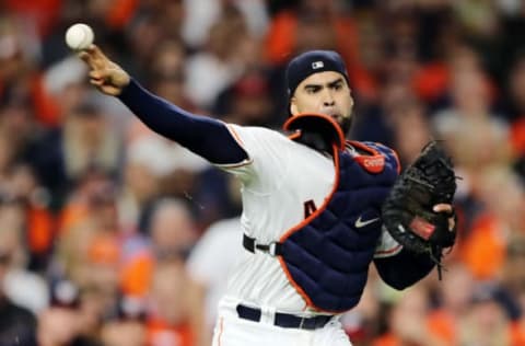 HOUSTON, TEXAS – OCTOBER 29: Robinson Chirinos #28 of the Houston Astros fields a bunt by Adam Eaton (not pictured) of the Washington Nationals during the first inning in Game Six of the 2019 World Series at Minute Maid Park on October 29, 2019 in Houston, Texas. (Photo by Elsa/Getty Images)