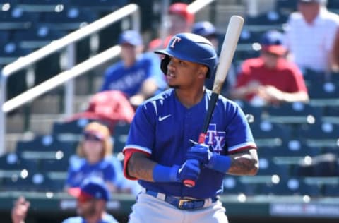 GOODYEAR, ARIZONA – FEBRUARY 24: Willie Calhoun #5 of the Texas Rangers gets ready in the batters box during a spring training game against the Cincinnati Reds at Goodyear Ballpark on February 24, 2020 in Goodyear, Arizona. (Photo by Norm Hall/Getty Images)