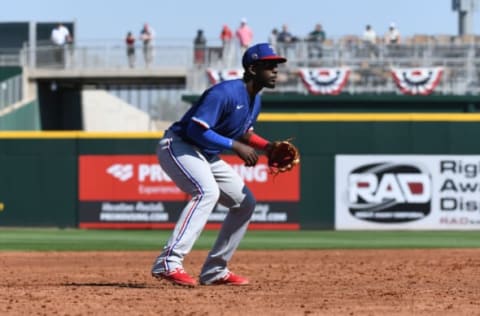 GOODYEAR, ARIZONA – FEBRUARY 24: Sherten Apostel #82 of the Texas Rangers gets ready to make a play at third base during a spring training game against the Cincinnati Reds at Goodyear Ballpark on February 24, 2020 in Goodyear, Arizona. (Photo by Norm Hall/Getty Images)