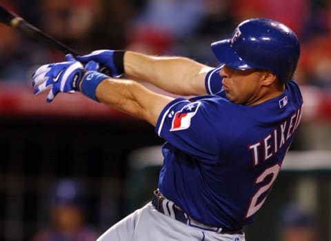 Mark Teixeira of the Texas Rangers bats during a 5-4 loss to the Los Angeles Angels of Anaheim at Angel Stadium in Anaheim, California on Tuesday, April 11, 2006. (Photo by Kirby Lee/Getty Images)