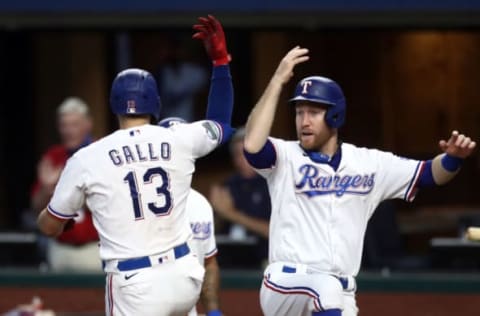 ARLINGTON, TEXAS – AUGUST 18: Joey Gallo #13 of the Texas Rangers celebrates a three-run home run with Todd Frazier #21 against the San Diego Padres in the fourth inning at Globe Life Field on August 18, 2020 in Arlington, Texas. (Photo by Ronald Martinez/Getty Images)