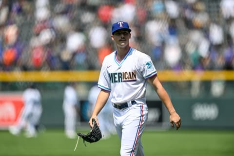 DENVER, CO – JULY 11: Cole Winn #22 of American League Futures Team looks on as players warm up before a game against the National League Futures Team at Coors Field on July 11, 2021 in Denver, Colorado.(Photo by Dustin Bradford/Getty Images)