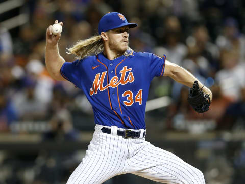 NEW YORK, NEW YORK – SEPTEMBER 28: Noah Syndergaard #34 of the New York Mets pitches during the first inning in game 2 of a double header against the Miami Marlins at Citi Field on September 28, 2021 in New York City. The Mets defeated the Marlins 2-1 in nine innings. (Photo by Jim McIsaac/Getty Images).