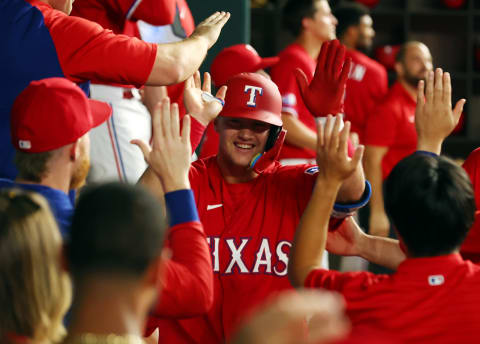 ARLINGTON, TEXAS – SEPTEMBER 09: Josh Jung #6 of the Texas Rangers is greeted in the dugout after a solo home run against the Toronto Blue Jays in the third inning at Globe Life Field on September 09, 2022 in Arlington, Texas. (Photo by Richard Rodriguez/Getty Images)