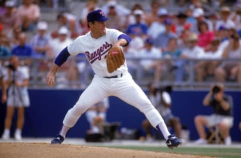 ARLINGTON, TX – 1990s: Nolan Ryan #34 of the Texas Rangers pitches during a circa 1990s game at Arlington Stadium in Arlington, Texas. Ryan pitched for the Rangers from 1989-93. (Photo by Jonathan Daniel/Getty Images)