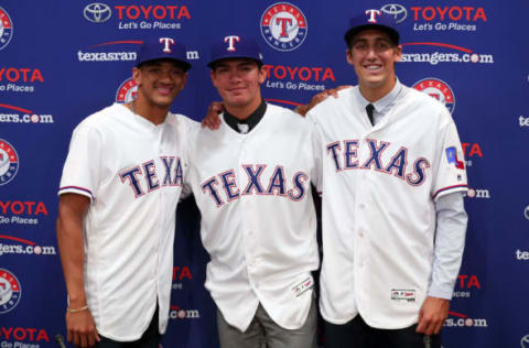 ARLINGTON, TX – JUNE 16: (L-R) Bubba Thompson from McGill-Toolen High School, Chris Seise out of West Orange High School and right-handed pitcher Hans Crouse out of Dana Hills High School pose for a photo after the Texas Rangers announced the signings of several of the club’s top selections in the 2017 Major League Baseball Draft at Globe Life Park in Arlington on June 16, 2017 in Arlington, Texas. (Photo by Tom Pennington/Getty Images)