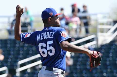 GOODYEAR, AZ – MARCH 02: Yohander Mendez #65 of the Texas Rangers delivers a first inning pitch against the Cleveland Indians during a spring training game at Goodyear Ballpark on March 2, 2018 in Goodyear, Arizona. (Photo by Norm Hall/Getty Images)