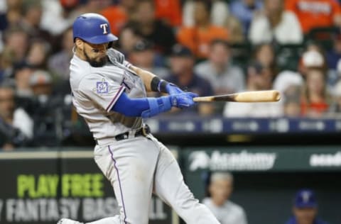 HOUSTON, TX – APRIL 15: Robinson Chirinos #61 of the Texas Rangers doubles in two runs in the tenth inning against the Houston Astros at Minute Maid Park on April 15, 2018 in Houston, Texas. All players are wearing #42 in honor of Jackie Robinson Day. (Photo by Bob Levey/Getty Images)