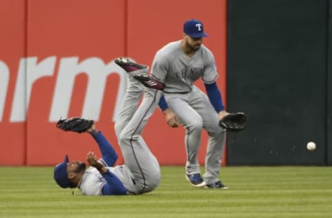 CHICAGO, IL – MAY 17: Delino DeShields (L) and Joey Gallo #13 of the Texas Rangers can’t catch a single hit by Nicky Delmonico #30 of the Chicago White Sox during the second inning on May 17, 2018 at Guaranteed Rate Field in Chicago, Illinois. (Photo by David Banks/Getty Images)