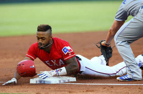 ARLINGTON, TX – MAY 25: Delino DeShields #3 of the Texas Rangers beats the tag on third base in the third inning against the Kansas City Royals at Globe Life Park in Arlington on May 25, 2018 in Arlington, Texas. (Photo by Rick Yeatts/Getty Images)