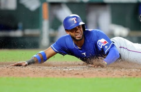 BALTIMORE, MD – JULY 13: Elvis Andrus #1 of the Texas Rangers slides into home plate and scores in the seventh inning against the Baltimore Orioles at Oriole Park at Camden Yards on July 13, 2018 in Baltimore, Maryland. (Photo by Greg Fiume/Getty Images)