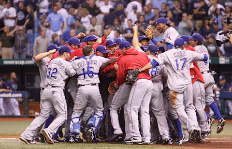 ST. PETERSBURG, FL – OCTOBER 12: The Texas Rangers celebrate after winning Game 5 of the ALDS against the Tampa Bay Rays at Tropicana Field on October 12, 2010 in St. Petersburg, Florida. (Photo by Mike Ehrmann/Getty Images)