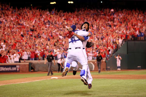 ARLINGTON, TX – OCTOBER 22: Bengie Molina #11 and Neftali Feliz #30 of the Texas Rangers celebrate after defeating the New York Yankees 6-1 in Game Six of the ALCS to advance to the World Series during the 2010 MLB Playoffs at Rangers Ballpark in Arlington on October 22, 2010 in Arlington, Texas. (Photo by Elsa/Getty Images)