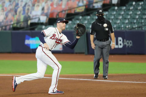 HOUSTON, TEXAS – OCTOBER 07: Freddie Freeman #5 of the Atlanta Braves fields a ground ball by Magneuris Sierra #34 of the Miami Marlins during the fifth inning in Game Two of the National League Division Series at Minute Maid Park on October 07, 2020 in Houston, Texas. (Photo by Bob Levey/Getty Images)