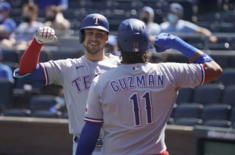 KANSAS CITY, MISSOURI - APRIL 04: Nate Lowe #30 of the Texas Rangers celebrates his three-run home run with Ronald Guzman in the third inning against the Kansas City Royals at Kauffman Stadium on April 04, 2021 in Kansas City, Missouri. (Photo by Ed Zurga/Getty Images)