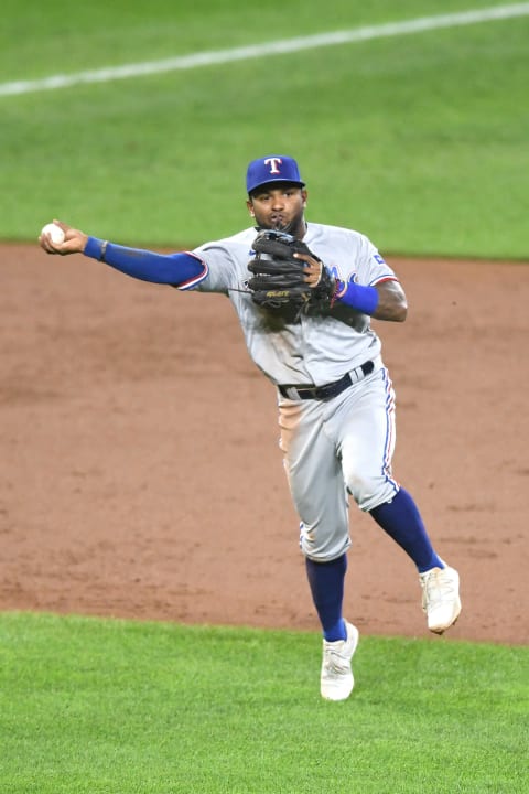 BALTIMORE, MD – SEPTEMBER 25: Yonny Hernandez #65 of the Texas Rangers fields a ground ball during a baseball game against the Baltimore Orioles at Oriole Park at Camden Yards on September 25, 2021 in Baltimore, Maryland. (Photo by Mitchell Layton/Getty Images)