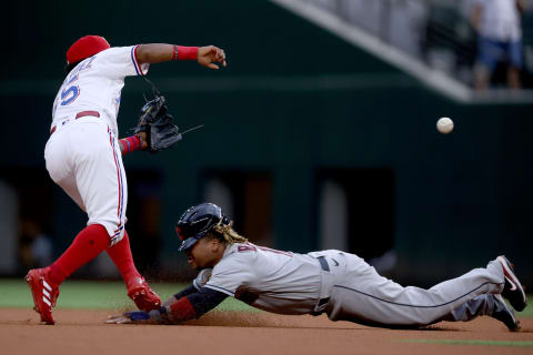 ARLINGTON, TEXAS – OCTOBER 02: Yonny Hernandez #65 of the Texas Rangers tags out Jose Ramirez #11 of the Cleveland Indians while Ramirez tries to steal second base in the top of the first inning at Globe Life Field on October 02, 2021 in Arlington, Texas. (Photo by Tom Pennington/Getty Images)