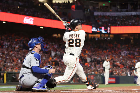 SAN FRANCISCO, CALIFORNIA – OCTOBER 08: Buster Posey #28 of the San Francisco Giants hits a two-run home run off Walker Buehler #21 of the Los Angeles Dodgers during the first inning of Game 1 of the National League Division Series at Oracle Park on October 08, 2021 in San Francisco, California. (Photo by Ezra Shaw/Getty Images)