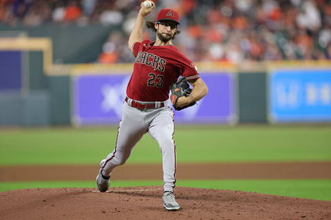 HOUSTON, TEXAS – SEPTEMBER 28: Zac Gallen #23 of the Arizona Diamondbacks delivers during the first inning against the Houston Astros at Minute Maid Park on September 28, 2022 in Houston, Texas. (Photo by Carmen Mandato/Getty Images)