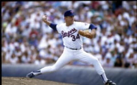 ARLINGTON, TX – 1993: Nolan Ryan of the Texas Rangers delivers a pitch during a game in 1993 at Arlington Stadium in Arlington, Texas. (Photo by Rich Pilling/MLB Photos via Getty Images)